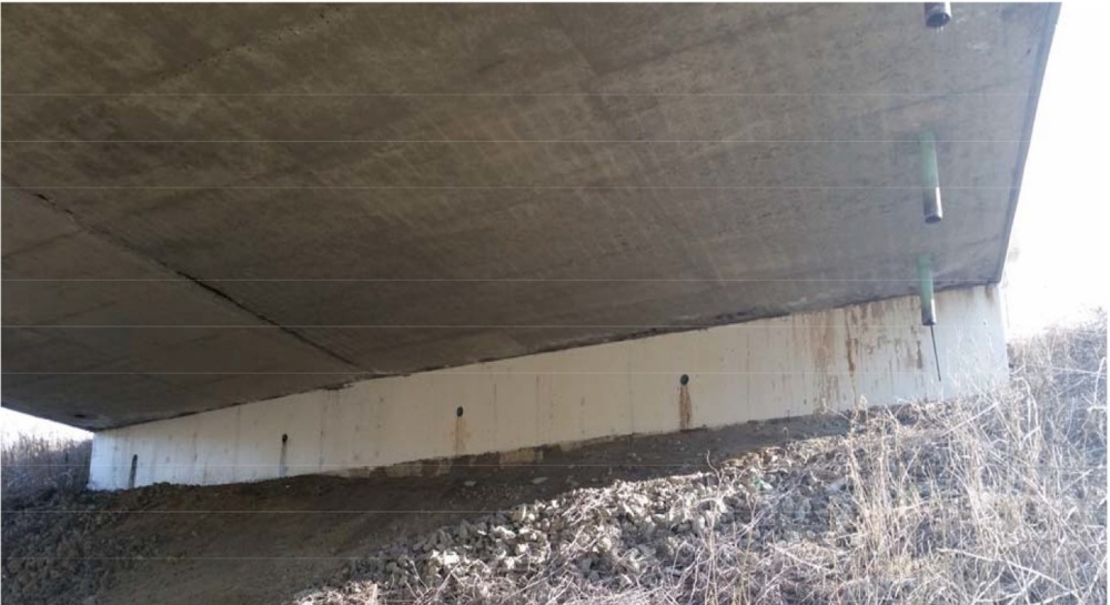 Abutment of I-75 Bridge over Kirkwood Road (mm 87) in 2022 (Note efflorescence from leaking joint and weep holes)